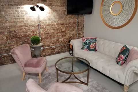 a living room filled with furniture and a fireplace