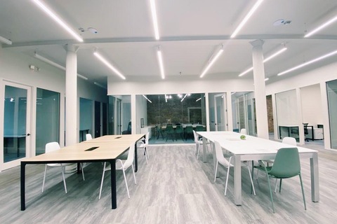 a room filled with furniture and a large window
