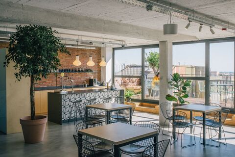 a room with tables and chairs