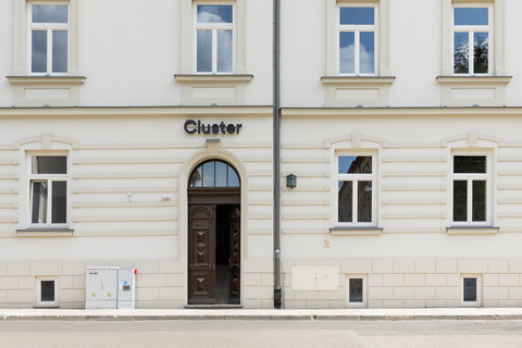 a building with a door and a sign