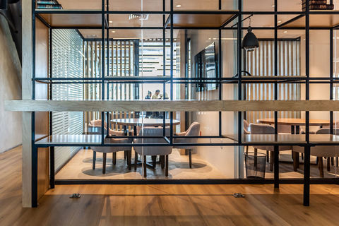 a room filled with furniture in front of a building