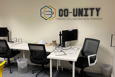a desk with a chair in a room