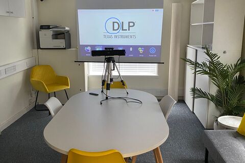 an office with a desk and chair in a room