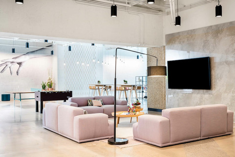a living room filled with furniture and a fireplace
