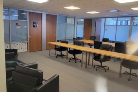 a room with a table and chairs