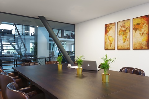 a living room filled with furniture and a large window