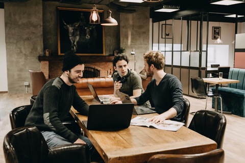 a group of people sitting at a table
