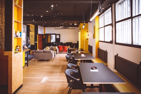 a room filled with furniture and a large window