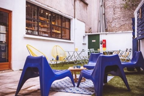 a table topped with a blue chair