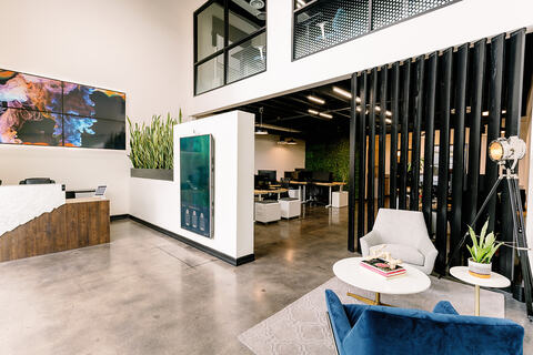 a room filled with furniture and a large window