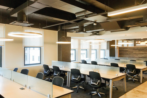 Multiple rows of coworking desk which provides a productive way to work