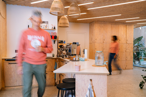 a man walking in a kitchen