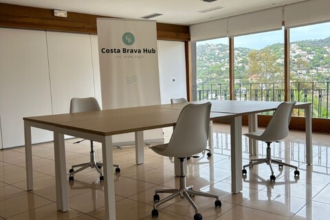 a room filled with furniture and a large window