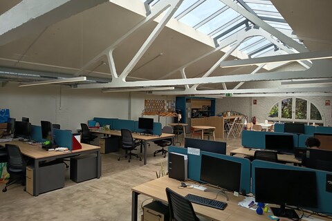 an office with desks and computers