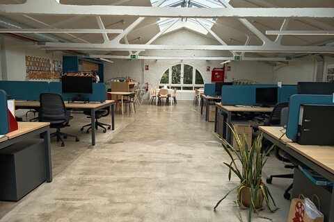 an office with desks and computers