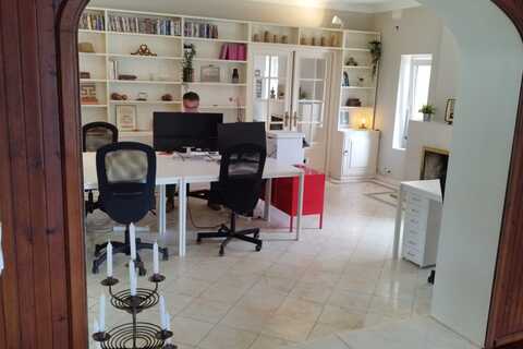a room filled with furniture and a large window