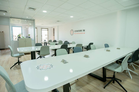 an office with a desk and chair in a room