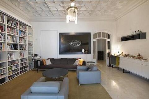 a living room filled with furniture and a fireplace