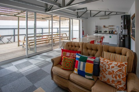 a living room filled with furniture and a fireplace