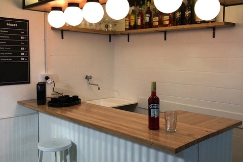 a kitchen with a sink and a mirror