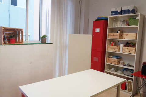 a red refrigerator and a table