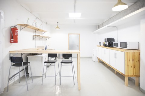 a kitchen with a table in a room
