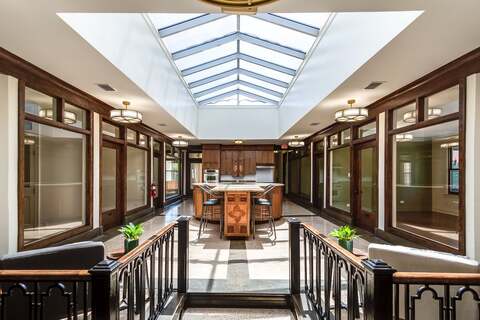 a room with a kitchen and a bar