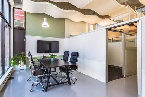 a room with a table and chairs