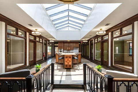a room with a kitchen and a bar