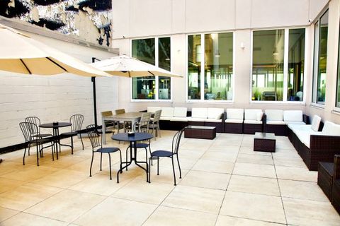 a dining room table in front of a building