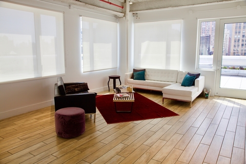 a room filled with furniture and a large window