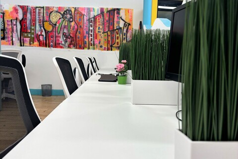 a white table with plants in it