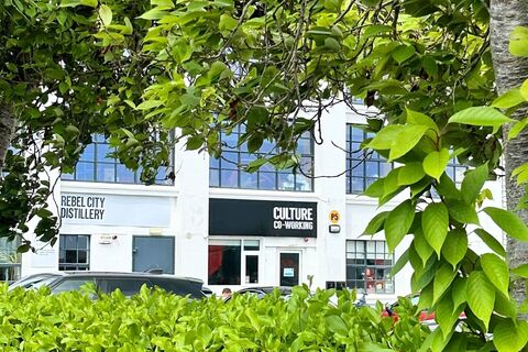 a building with trees and bushes