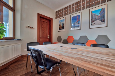 a room with a table and chairs