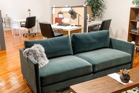 a living room filled with furniture and a fireplace