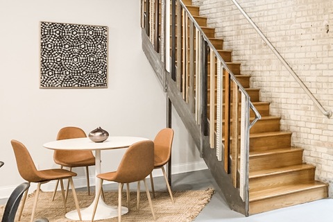 a room filled with furniture on top of a wooden chair