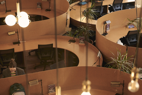 a group of people working at desks