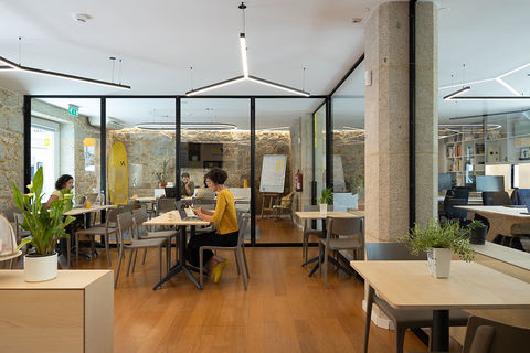 a dining room table in front of a window