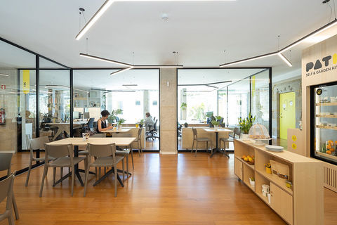 a room filled with furniture and a large window