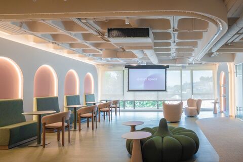 a room with chairs and a projector screen