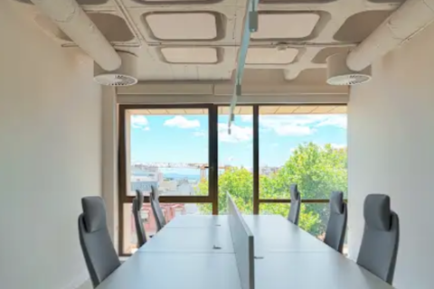 a conference room with a table and chairs