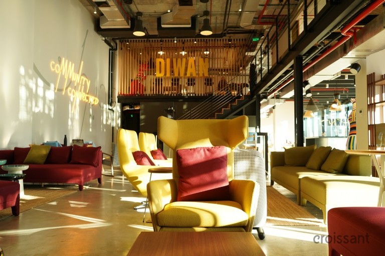 a living room filled with furniture and a table