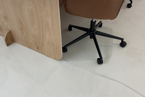 a chair with wheels and a table