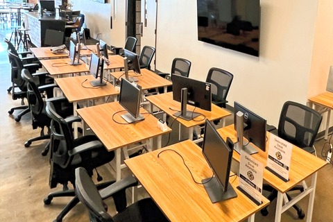 an office with a desk and chair in a room