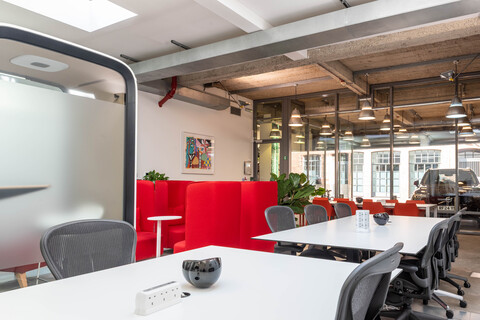 a train that is sitting on a chair in a room