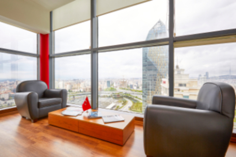 a living room filled with furniture and a large window