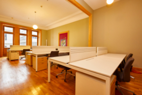 a room filled with furniture and a wood floor