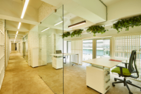 a room filled with furniture and a large window