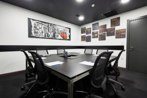an office with a desk and chair in a room