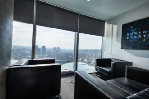 a view of a living room with a large window